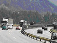 Trucks nose-to-tail on the Brenner, with or without rail tunnel